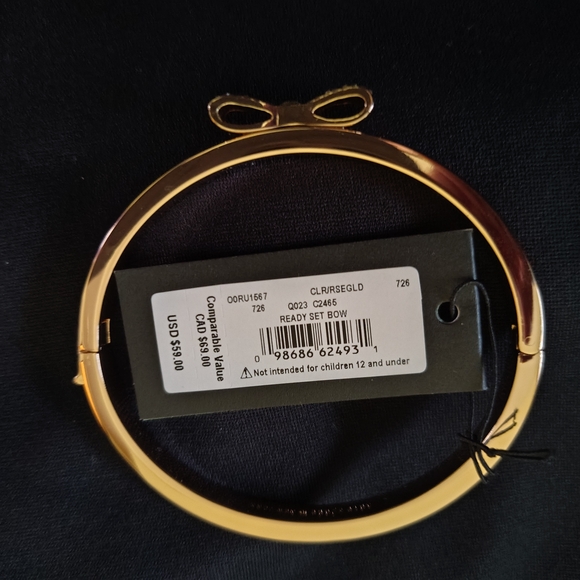 Kate Spade Gold Plated Bow Bracelet 7". - Picture 2 of 4